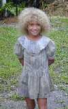 A young native Fijian girl as she was gathering coconuts for food with her brother (not pictured). You gotta love the hair!